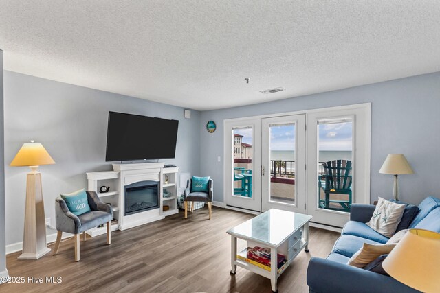 living room featuring light hardwood / wood-style floors and ceiling fan