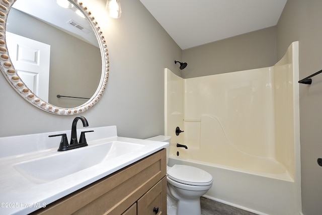 full bathroom featuring shower / washtub combination, vanity, and toilet