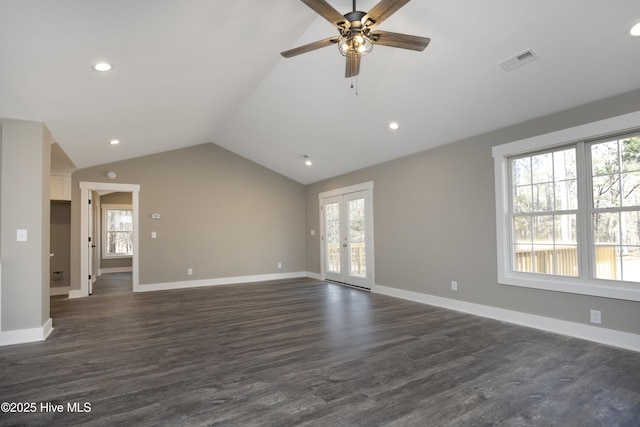 unfurnished living room with dark wood-type flooring, vaulted ceiling, french doors, and ceiling fan