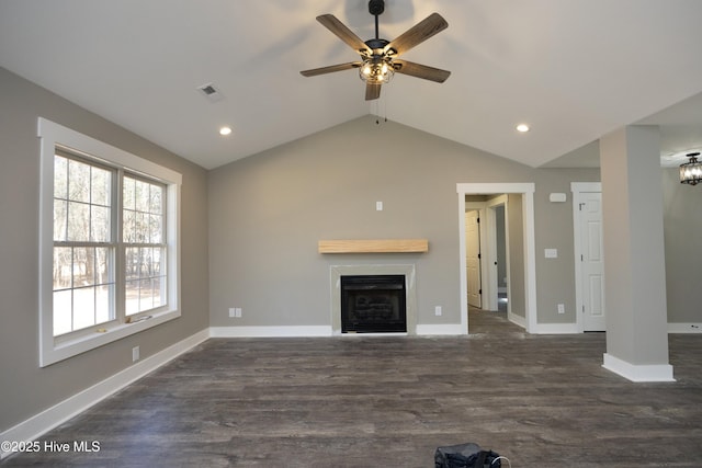 unfurnished living room featuring lofted ceiling, dark hardwood / wood-style floors, and ceiling fan