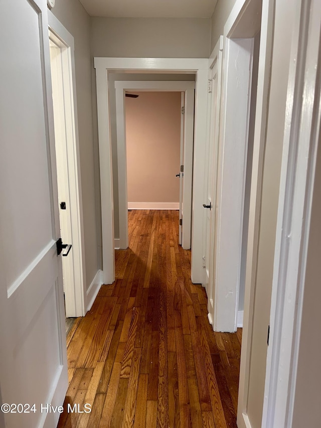 hall with dark hardwood / wood-style floors