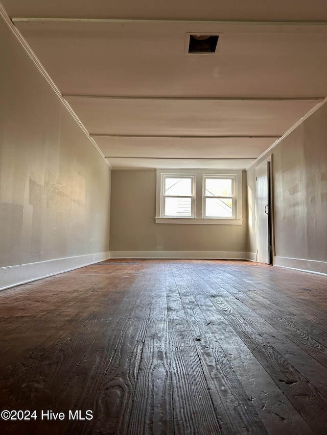 empty room with hardwood / wood-style flooring