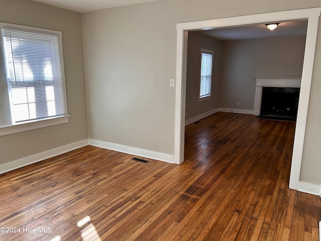 spare room featuring dark hardwood / wood-style floors