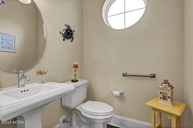 bathroom with toilet and sink