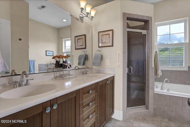 bathroom featuring tile patterned flooring, vanity, and separate shower and tub