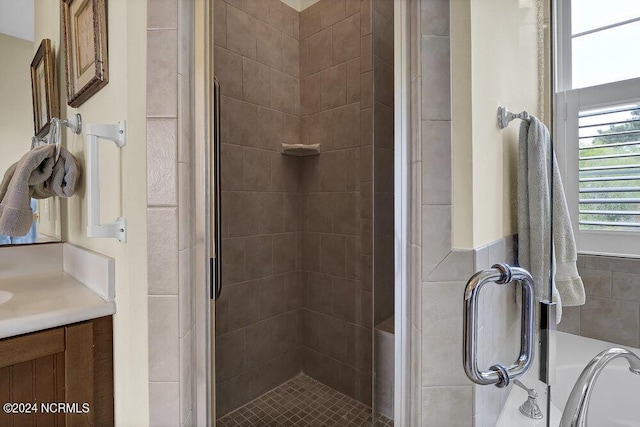 bathroom with vanity and an enclosed shower