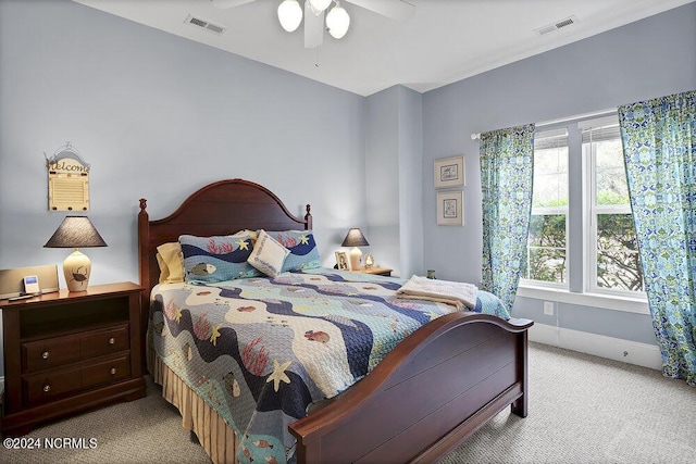 bedroom featuring light carpet and ceiling fan