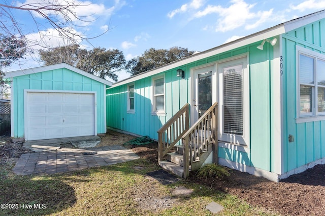 view of front of house featuring an outbuilding and a garage