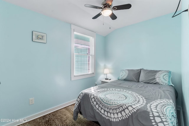 bedroom featuring vaulted ceiling and ceiling fan