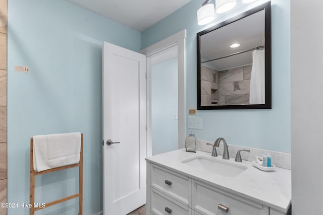 bathroom with vanity and walk in shower