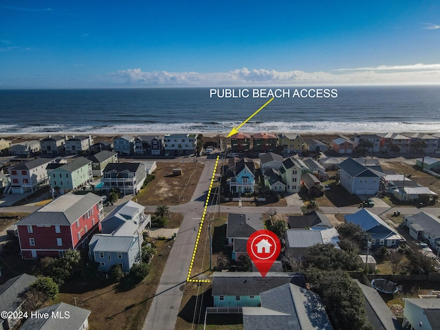 bird's eye view with a water view and a view of the beach