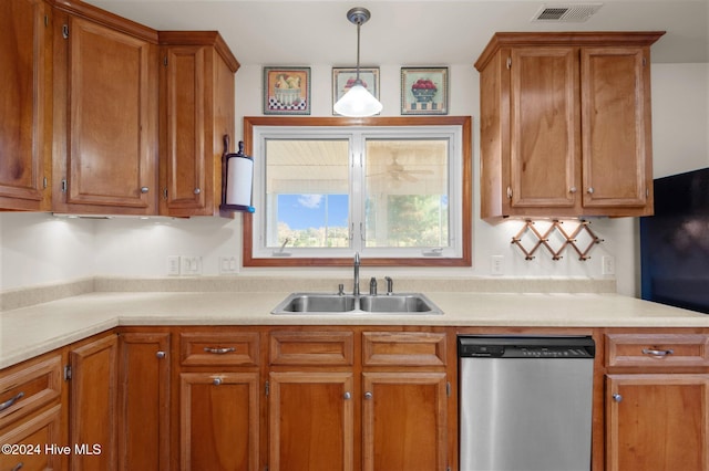 kitchen with dishwasher, pendant lighting, and sink