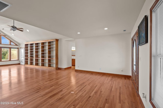 unfurnished living room with ceiling fan, light hardwood / wood-style flooring, and vaulted ceiling