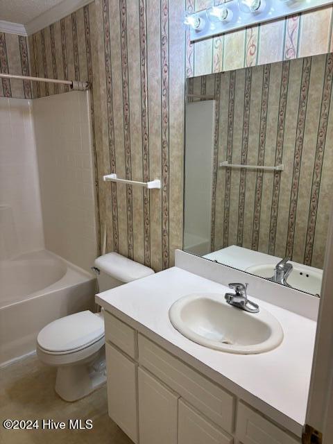 full bathroom with vanity, toilet, and shower / washtub combination
