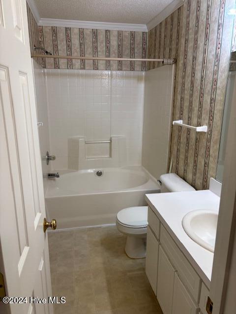 full bathroom with vanity, a textured ceiling, crown molding, shower / tub combination, and toilet