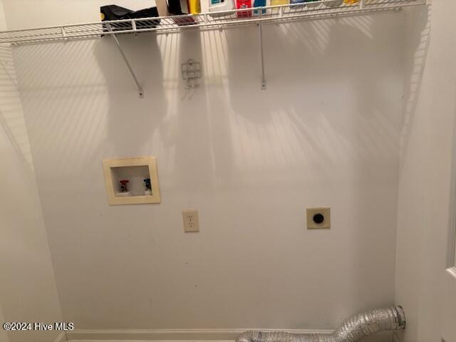 laundry room with hookup for an electric dryer and hookup for a washing machine