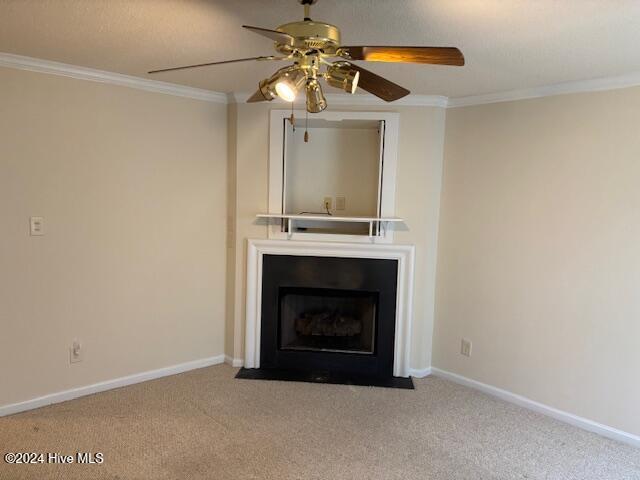 unfurnished living room featuring crown molding, ceiling fan, and light colored carpet