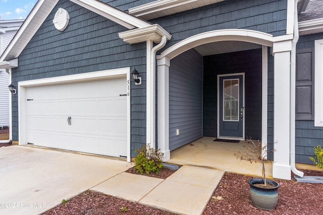 entrance to property featuring a garage