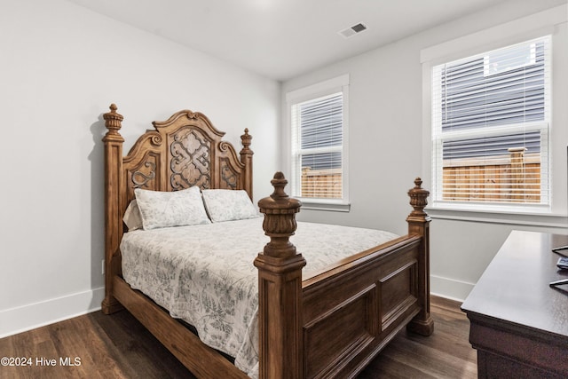 bedroom featuring dark wood-type flooring