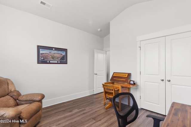 office featuring dark hardwood / wood-style floors and lofted ceiling