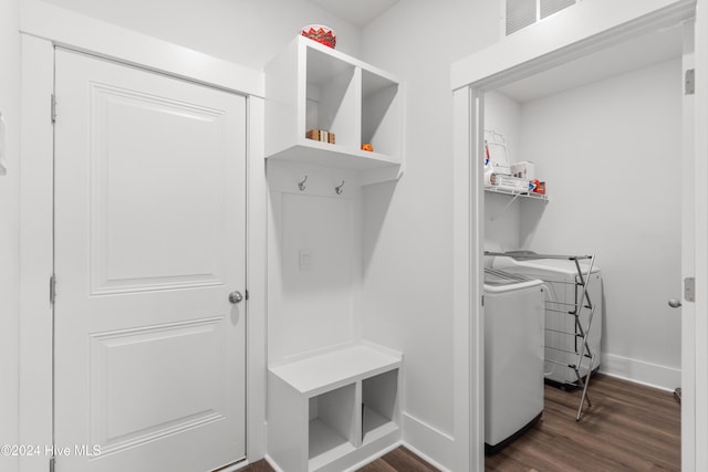 mudroom featuring dark hardwood / wood-style floors and washing machine and clothes dryer