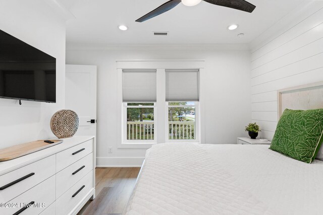 bedroom featuring ceiling fan and dark hardwood / wood-style flooring