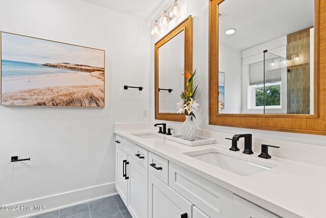 bathroom featuring tile patterned flooring and vanity