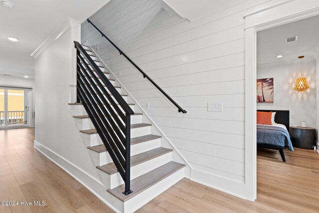 staircase featuring hardwood / wood-style flooring