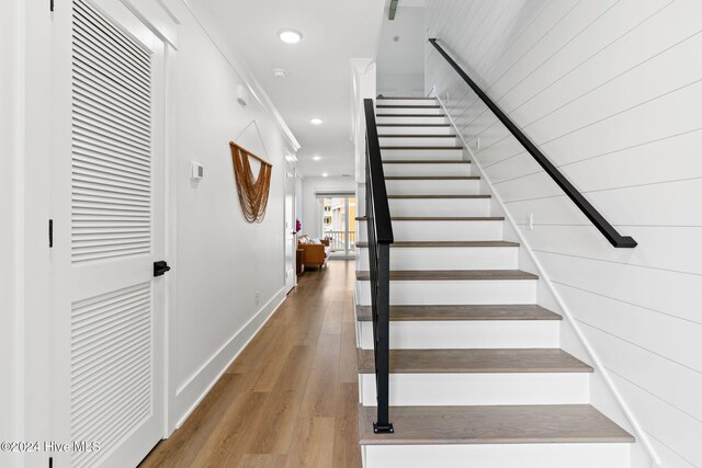 stairs with wood-type flooring