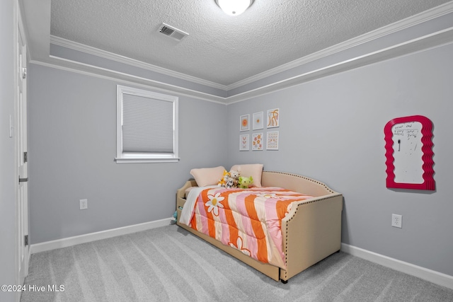 bedroom with carpet, ornamental molding, and a textured ceiling