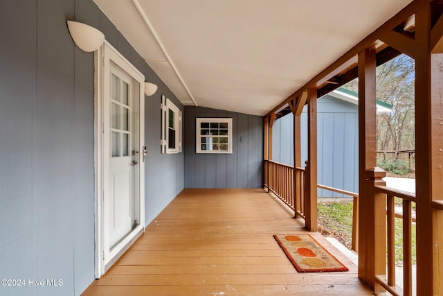 exterior space featuring plenty of natural light and vaulted ceiling