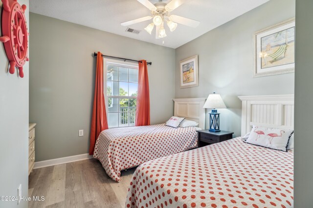 bedroom featuring light wood-type flooring and ceiling fan