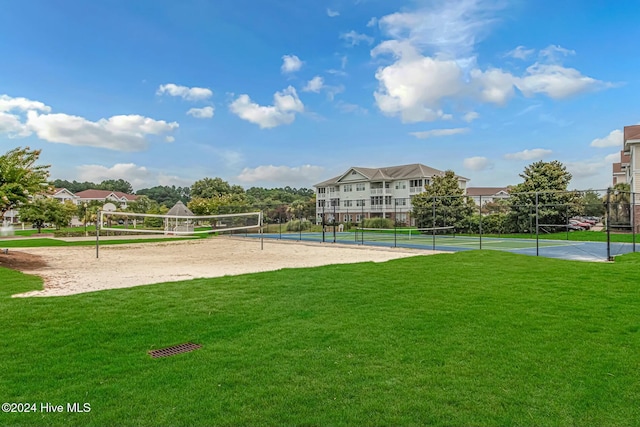 view of community featuring a lawn and volleyball court