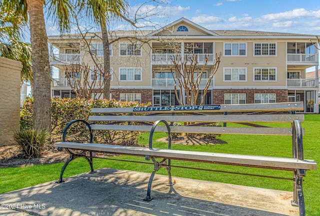 view of community featuring a lawn