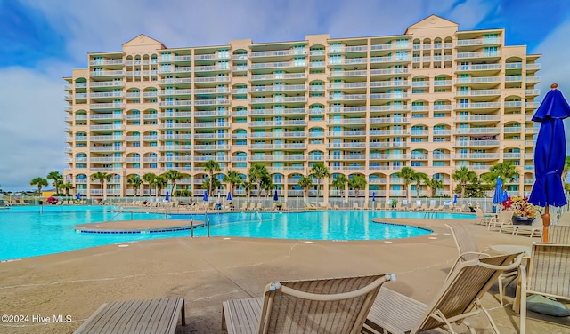 view of pool featuring a patio