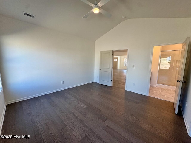 unfurnished bedroom with baseboards, visible vents, a ceiling fan, dark wood-style flooring, and high vaulted ceiling