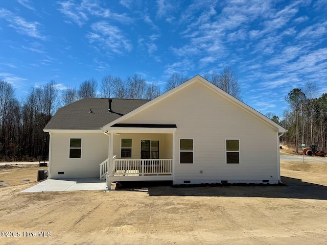 rear view of house with a patio, a shingled roof, crawl space, and a porch