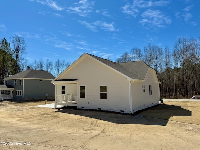 view of side of home featuring crawl space