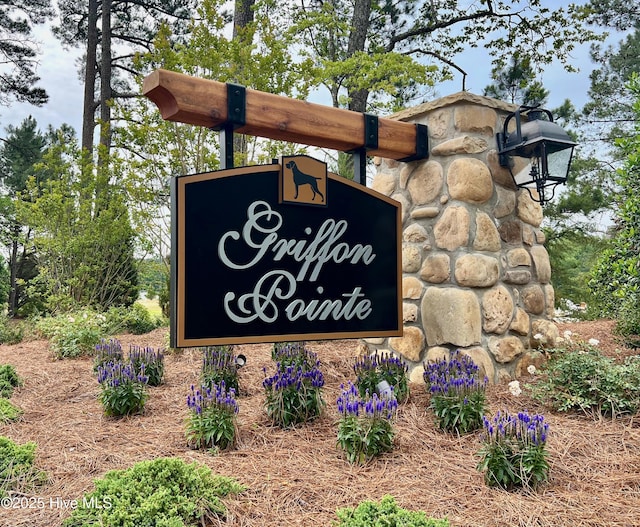 community sign with a carport