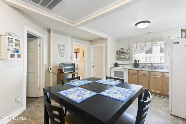 dining space featuring sink