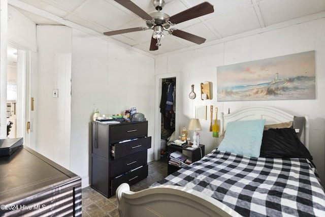 bedroom featuring ceiling fan and a closet