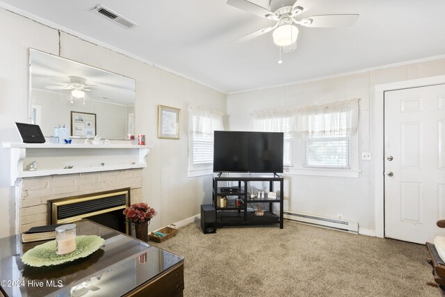 carpeted living room featuring ornamental molding, a brick fireplace, and a baseboard heating unit