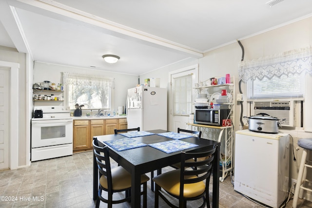 dining space with sink, cooling unit, and ornamental molding