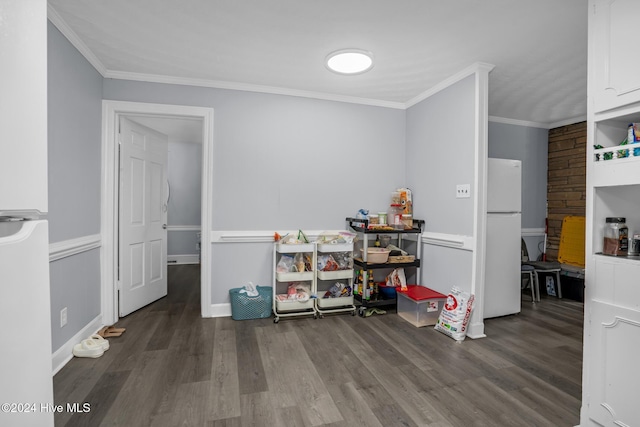 interior space with ornamental molding and hardwood / wood-style flooring