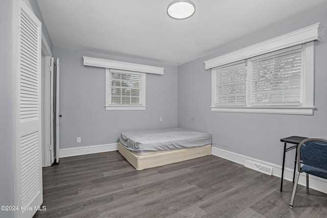 bedroom featuring dark hardwood / wood-style flooring