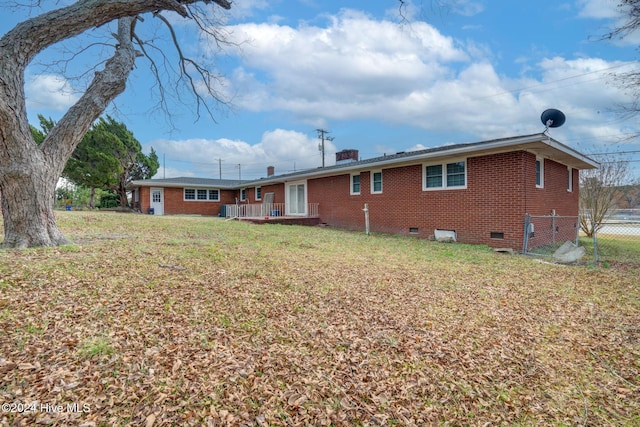 back of house with a yard