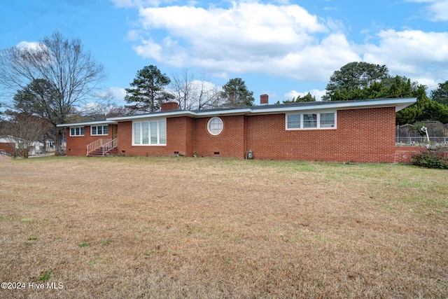 single story home featuring a front yard