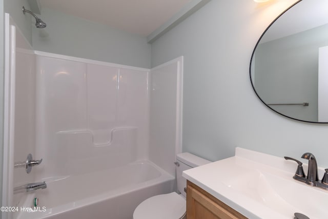 full bathroom featuring washtub / shower combination, vanity, and toilet