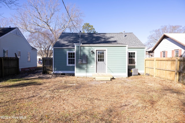 rear view of house with cooling unit