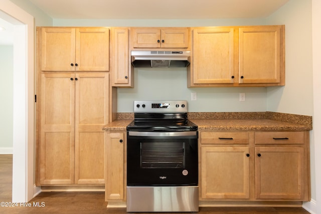 kitchen with electric stove, light brown cabinets, and dark hardwood / wood-style floors